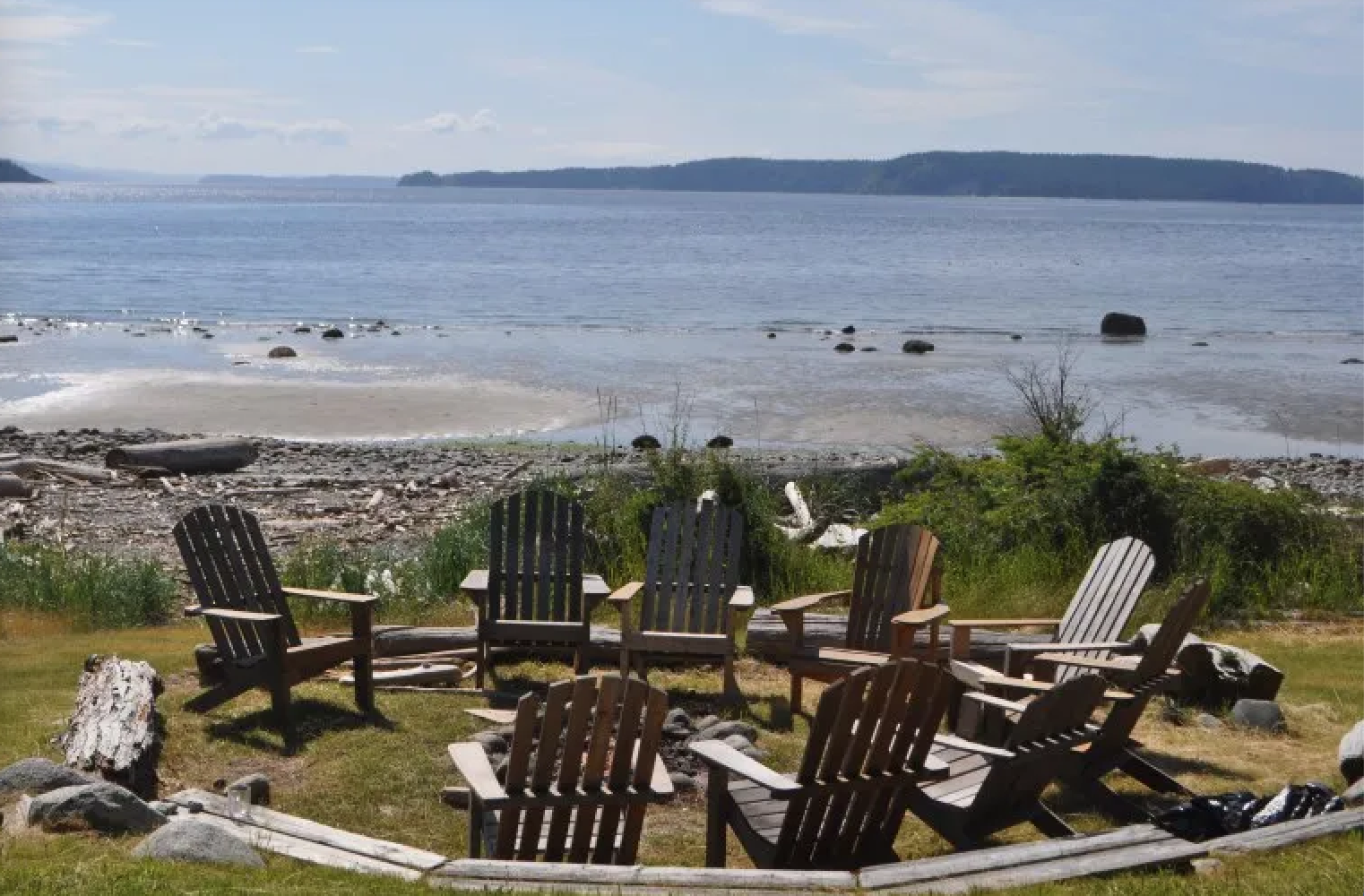 View of chairs in a circle on the shore